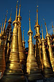 Inle Lake Myanmar. Indein, on the summit of a hill the  Shwe Inn Thein Paya a cluster of hundreds of ancient stupas. Many of them are ruined and overgrown with bushes. 